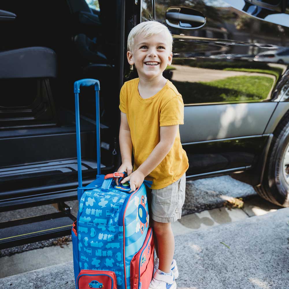 child-entering-car-with-train-suitcase